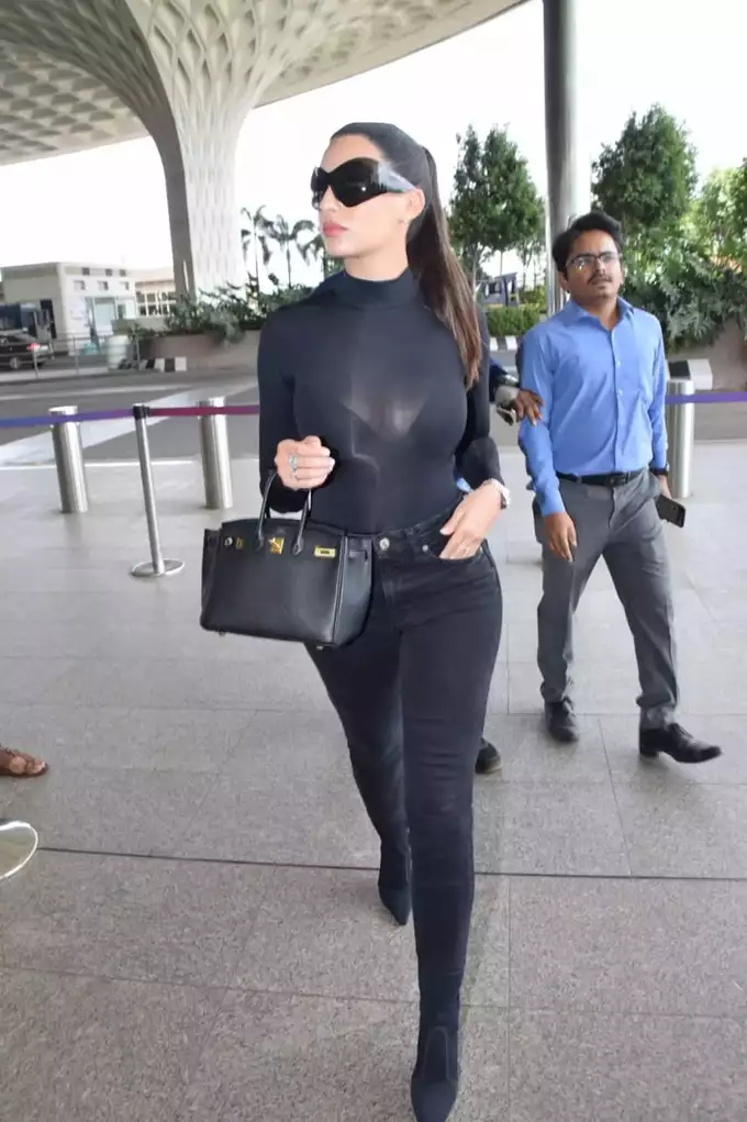 Nora Fatehi spotted at the airport carrying Louis Vuitton Petit