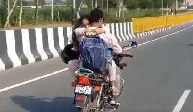 Girl seen hugging her boyfriend while sitting on the tank of a moving bike, police issued a challan of Rs 8 thousand - watch video